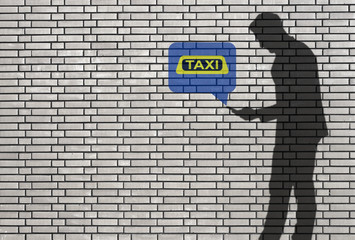 Fototapeta premium silhouette of man with smartphone - ordering a taxi