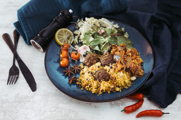 Kofta Tagine Moroccan Meatballs Served With Semolina and Vegetables