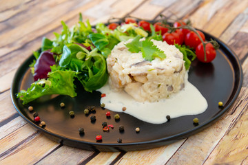 risotto with fresh cream, salted chicken, rehydrated ceps and mushrooms