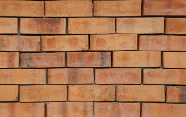 Closeup of brown brick wall with sunlight. The natural art background and template. 