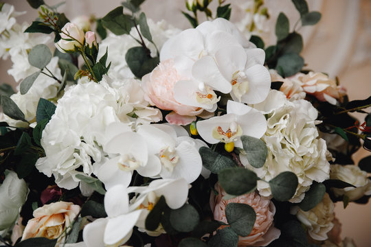 Artificial flowers in bouquet, real sensations, on white background