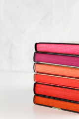Pile of books with color stack on white background. Copy space