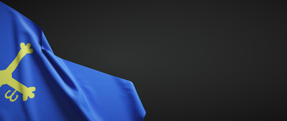 Bandera de Asturias de tela sobre fondo oscuro