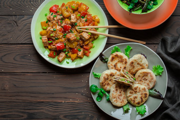 Sichuan food. Cina. Chinese meat pie - xian bing. Panfried.  Tofu and peppers. Green beans with walnuts.