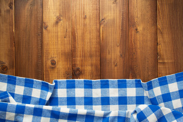 checked cloth napkin at wooden table