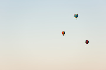 Flying in a balloon. Three objects in the air against the cloudless sky