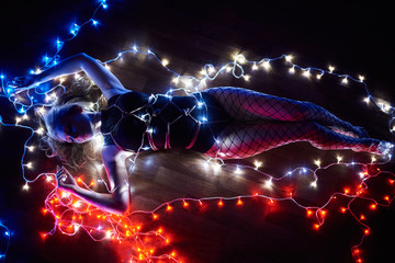 Shibari in the light of many lights. Domination over beautiful blonde