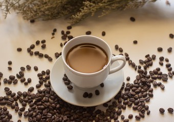 Coffee in cups and coffee beans