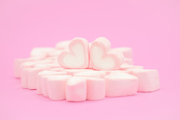 Obraz na płótnie Canvas Pink hear marshmallow , Sweets hearts of marshmallow on pink background. Valentine's Day Gift