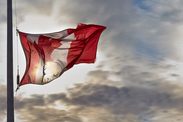 Canada Canadian national flag textile cloth fabric waving on the top sunrise mist fog