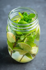 Lime, mint and ginger detox drink in jar. Selective focus.