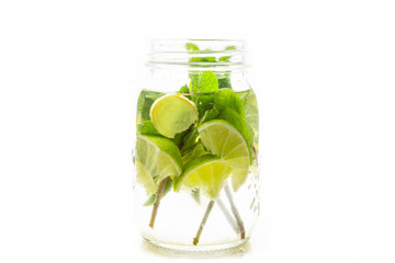 Lime, mint and ginger detox drink in jar. Selective focus.