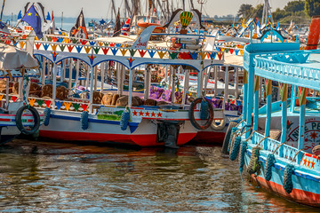 12.11.2018 Aswan, Egypt, Colorful painted boats felucca on the river nil on a sunny day