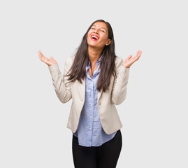 Young business indian woman laughing and having fun, being relaxed and cheerful, feels confident and successful