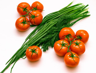Fototapeta na wymiar red tomato with greens 
