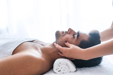 Face Massage. Close-up of a Young Male Getting Spa Treatment.