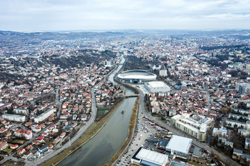Fototapeta na wymiar Aerial above view of river crossing the city