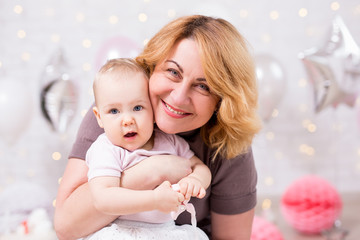 cute little baby girl and her grandmother