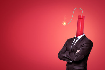 A waste-deep image of a businessman with a big dynamite stick with its wick burning instead of head...