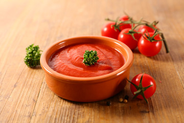 tomato sauce on wood background