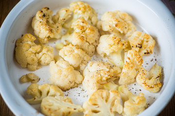 baked cauliflower with spices in ceramic form