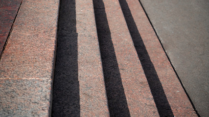 Obraz premium Horizontal view of shadows projected on the granite stairs