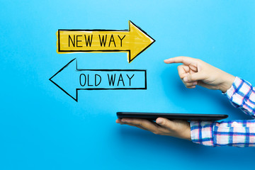 Old way or new way with a tablet computer on a blue background