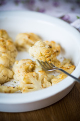 baked cauliflower with spices in ceramic form
