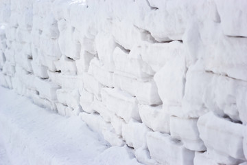The wall is built of snow blocks