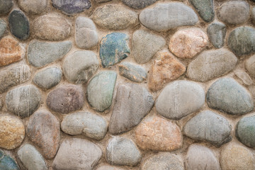 Gray pebble stone wall. pebbles. high resolution background