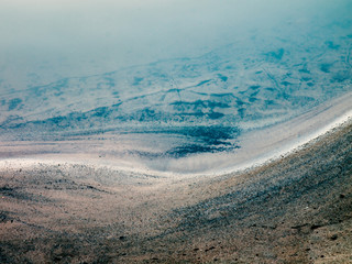 Clos-up of a bank of a mountain stream as artistic, abstract background
