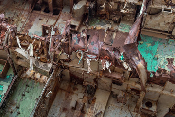 Internal parts of decommissioned marine ship that was cut and left on the shore.