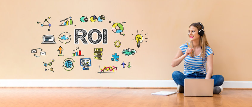 ROI with young woman with headphones using a laptop computer and a pencil