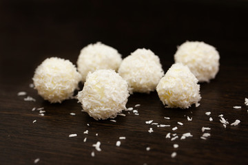 beautiful sweets on wooden dark surface close-up.