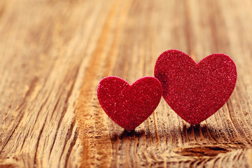 Two hearts on a wooden background on Valentines Day