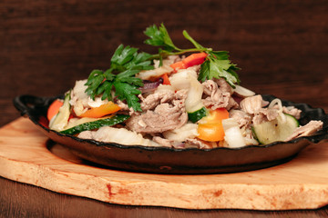 European international fusion cuisine, a beautiful dish on a white plate decorated with herbs and vegetables. a professional chef has prepared a delicious meal.