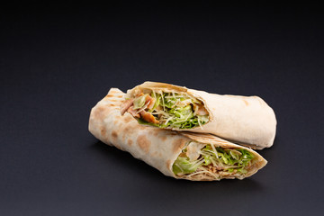 the Delicious shawarma on a black background