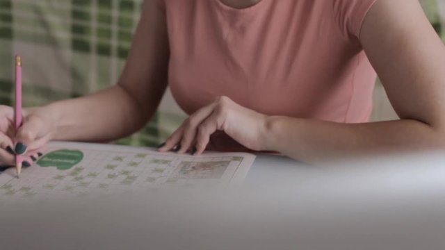 woman writing on notebook