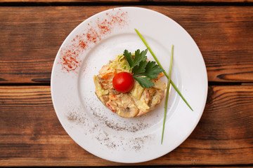 European international fusion cuisine, a beautiful dish on a white plate decorated with herbs and vegetables. a professional chef has prepared a delicious meal.