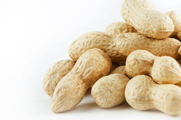 Peanuts. Two peeled nuts isolated on white background. Peanut macro.