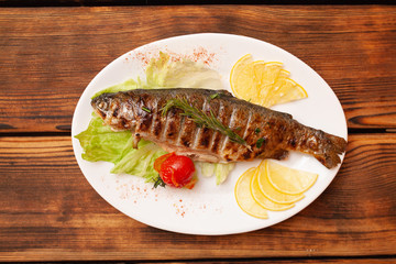 European international fusion cuisine, a beautiful dish on a white plate decorated with herbs and vegetables. a professional chef has prepared a delicious meal.