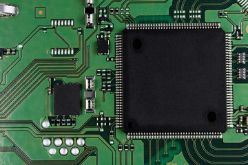 Microchips and microcircuits are installed on a modern electronic circuit board macro