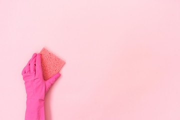 Woman holding soft cleaning sponge for washing in her hands