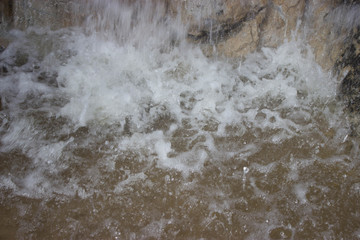 the water spray from the waterfall