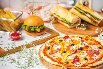 delicious lunch, pizza, hamburger, sandwich and french fries