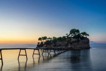 Greece, Zakynthos, Wooden boardwalk to cameo island in twilight mood
