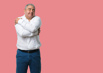 Middle aged man proud and confident, pointing fingers, example to follow, concept of satisfaction,...