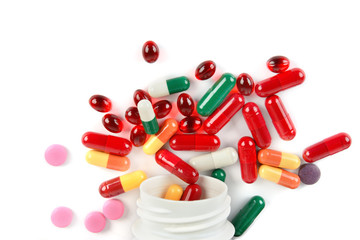 Assorted pharmaceutical medicine pills, tablets and capsules isolated on white background.