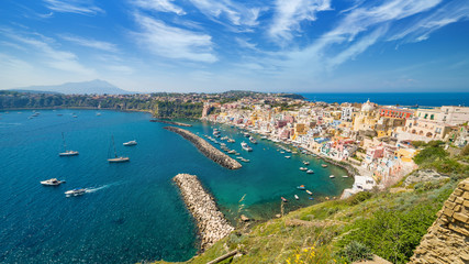 Fototapeta premium Colorful housing, fishing boats and yachts, cafes and restaurants in Marina Corricella, Procida island, Italy