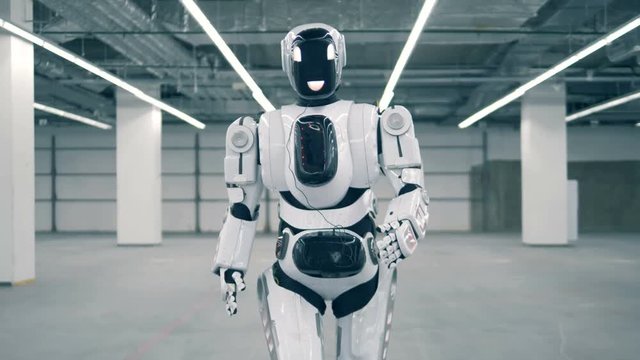 Modern robot, cyborg, android walks in a room. Concept of future